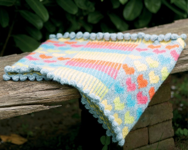 Mit dickem Garn in ein oder zwei Stricknadelumdrehungen gestrickter Snood. Schemata, Beschreibung