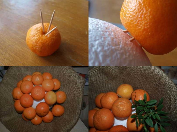 Blumenstrauß aus Mandarinen und Tannenzweigen mit eigenen Händen