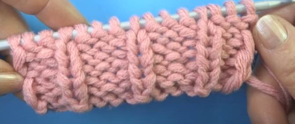 Ährchenmuster-Stricknadeln. Schema und Beschreibung der länglichen Schleifen, durchbrochen