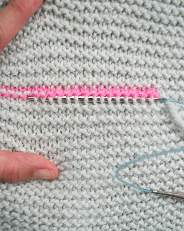Rechteckige Weste mit Nadeln gestrickt. Schema und Beschreibung